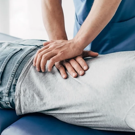 Chiropractor giving a back adjustment.