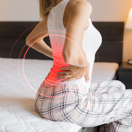 Woman holding her back in pain.