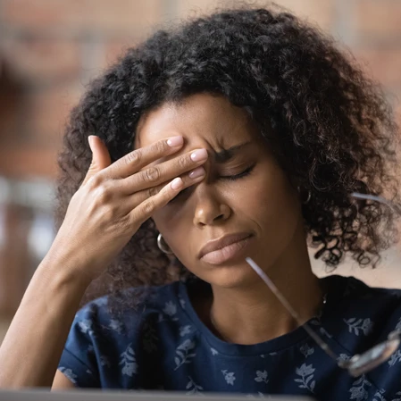 A woman with head pain.