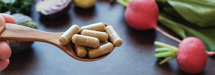 Chiropractic Huntsville AL Supplements Supplements on a spoon.