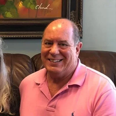 Dr. Herbert Buckner smiling.